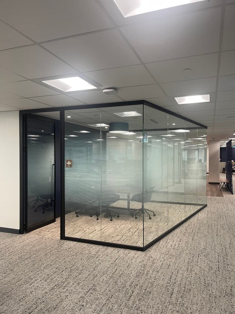 Corporate glass partition with frosted design detail