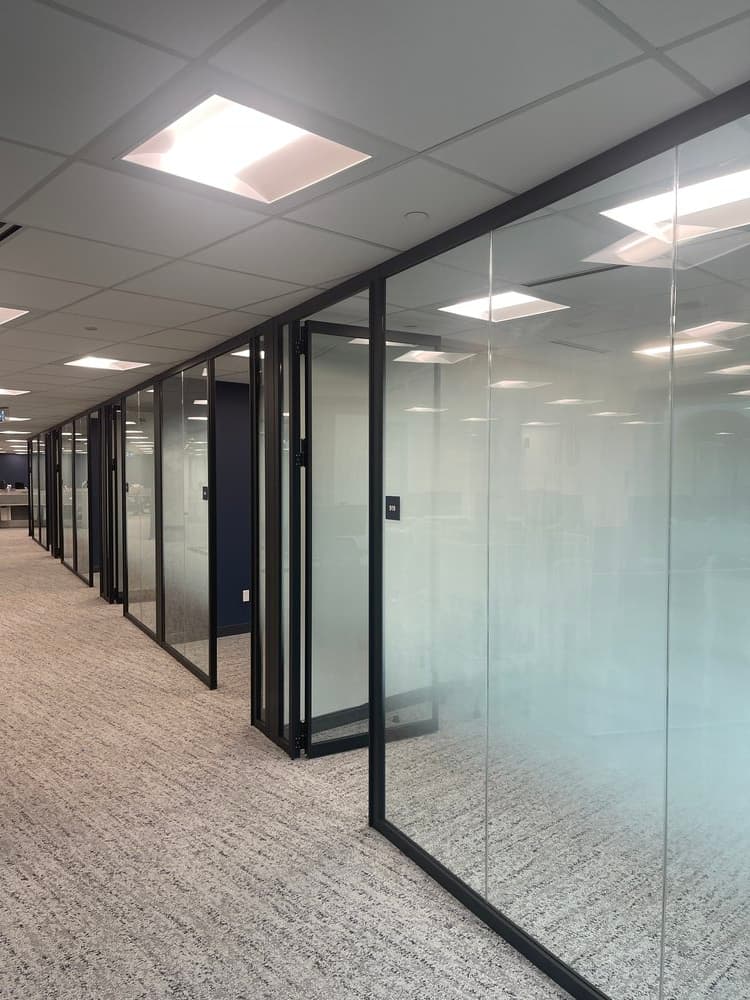 Corporate office glass partition with etched graphic