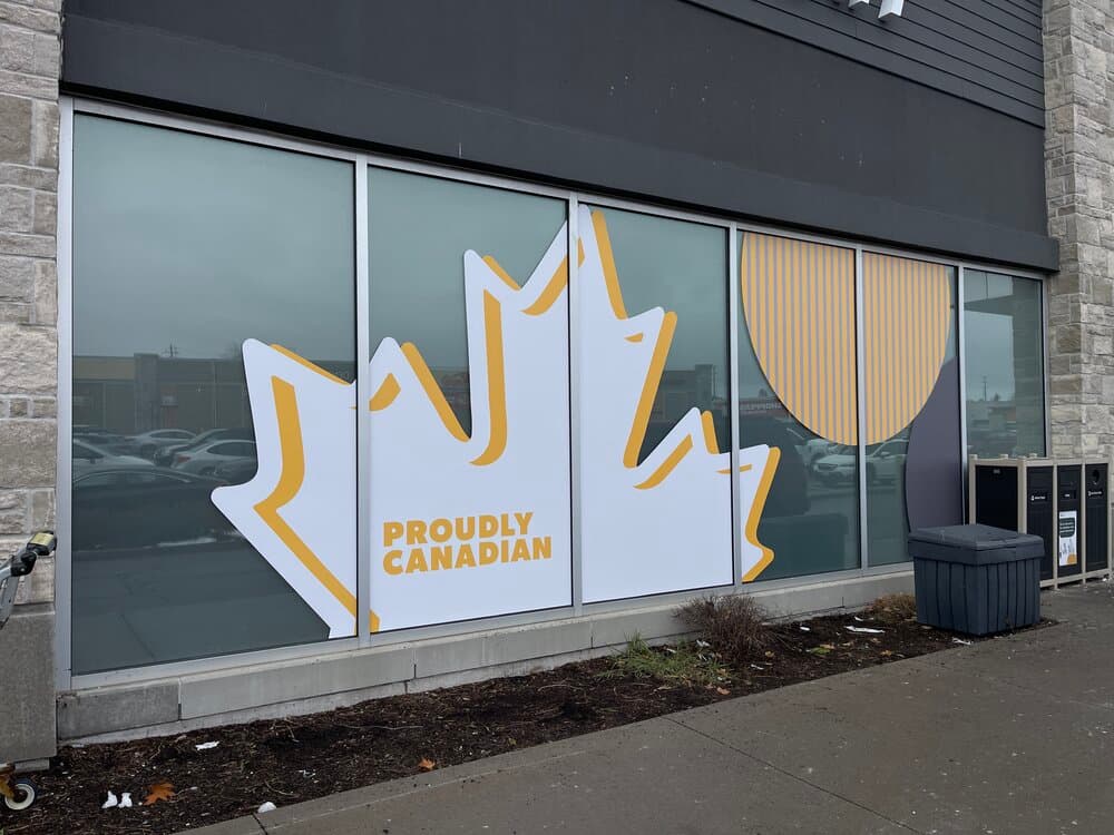 Fit4Less maple leaf large format window graphic