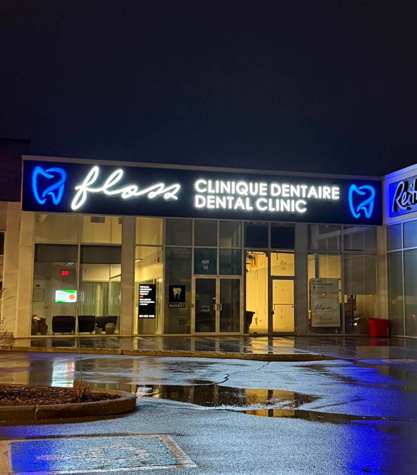 Floss Dental Clinique Dentaire illuminated channel letter sign at night, Plaza Hawkesbury