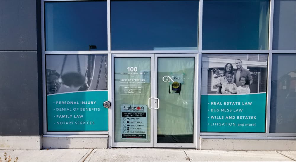 GN Law window graphics — services storefront