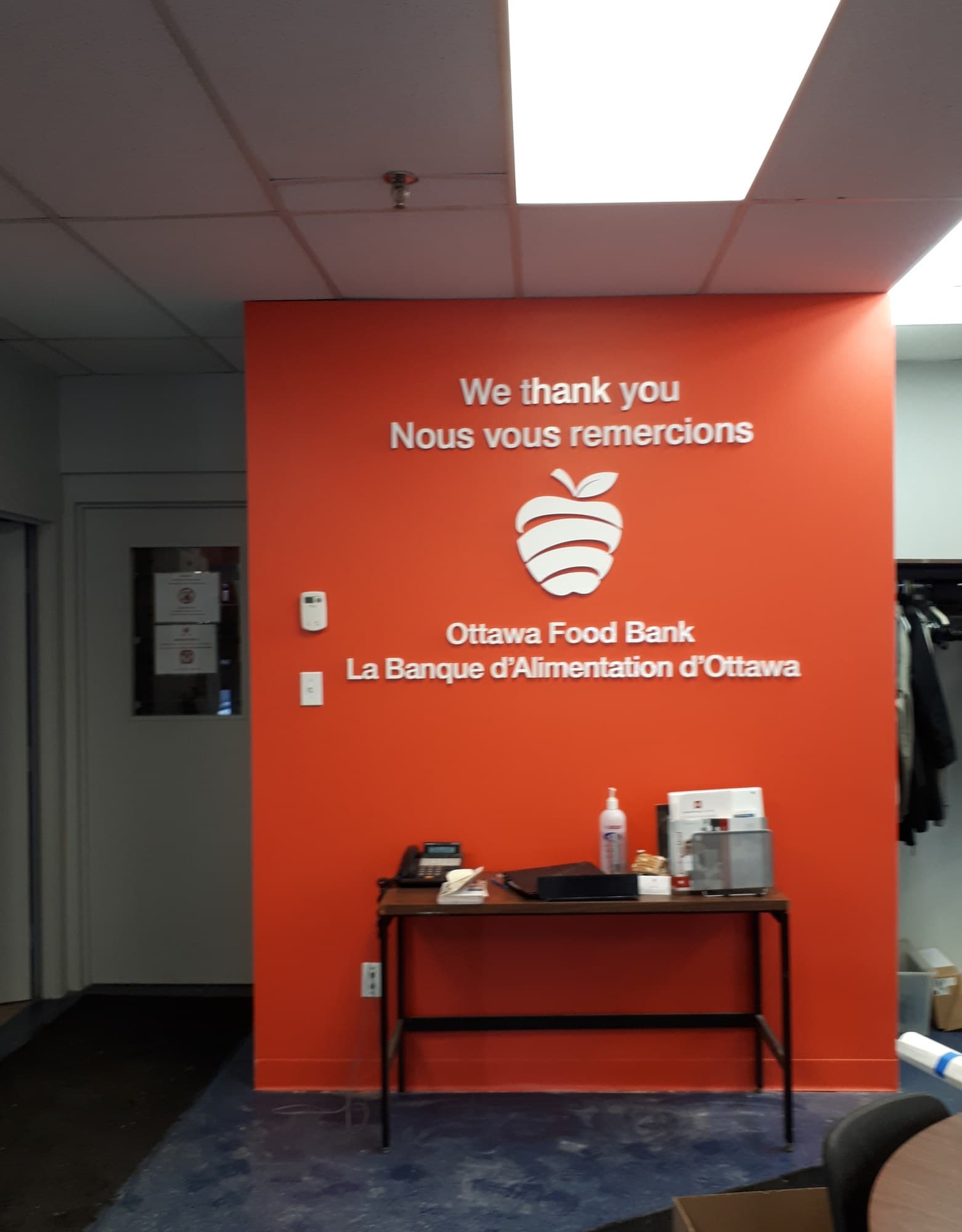 Ottawa Food Bank donor recognition wall with bilingual thank-you messaging